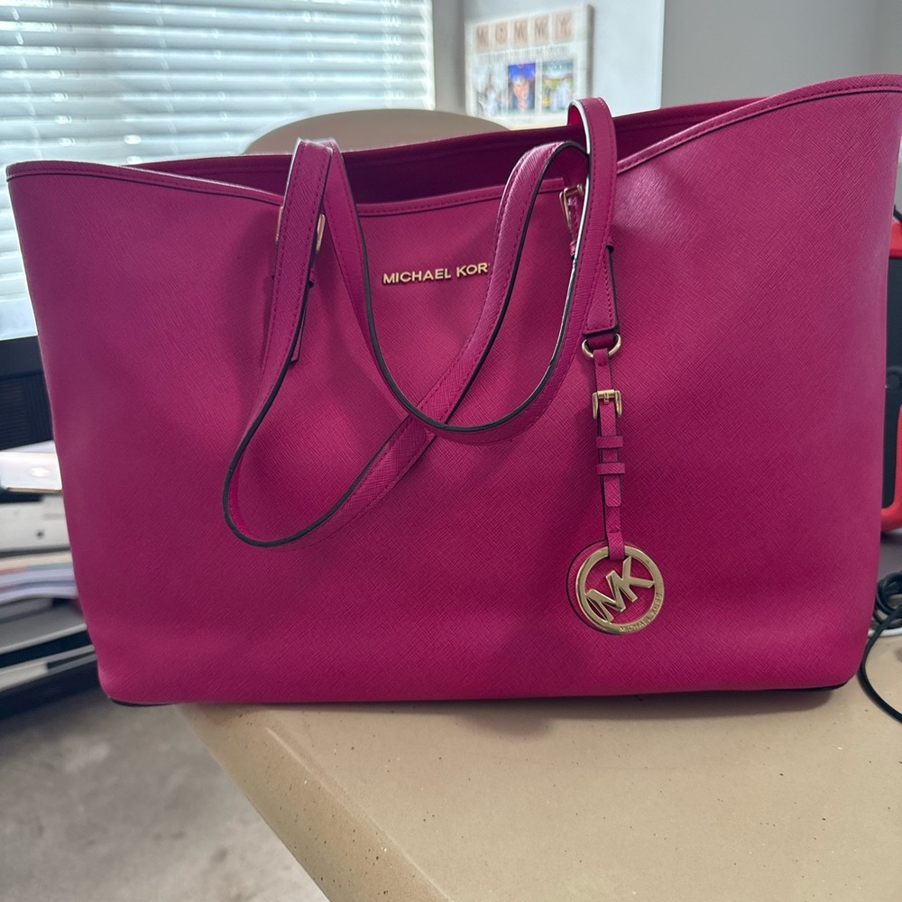 GENTLY USED - Michael Kors Pink Tote Bag with “semi” matching wristlet wallet.